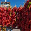 2 foot red chile ristras in front of Farmers Chile market-2 Hatch Chile Starter Kit