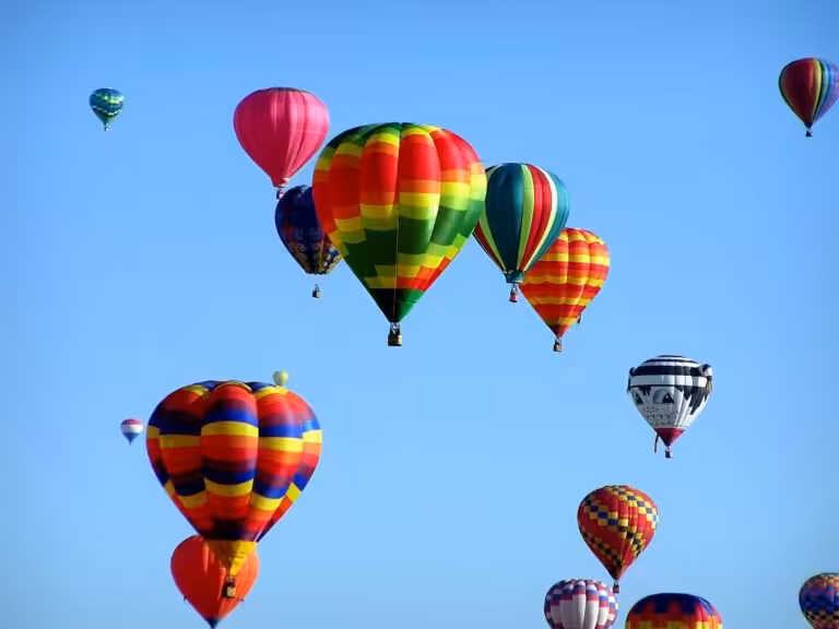 red green hot air balloon during daytime