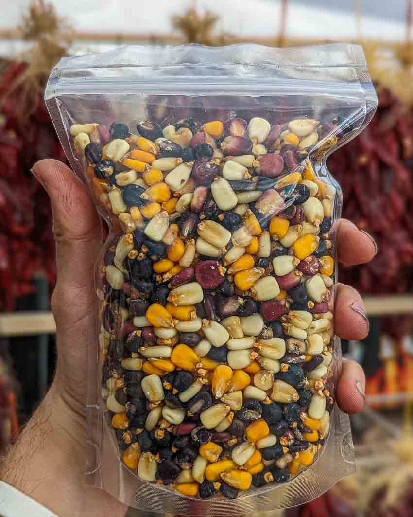 a bag of multicolor dry New Mexico hominy