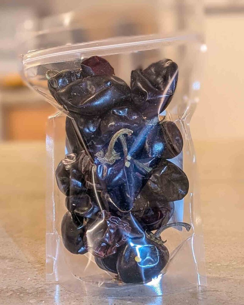 2 oz bag of Mexican cascabel chile back back of 2 oz bag of Mexican cascabel chile