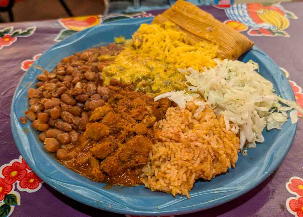 a tamale and carne adovada plate in Hatch, New Mexico